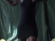 Girl dances in short dress with her pussy showing