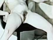 Barbie having a smoke naked in chair legs apart