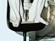 Barbie having a smoke naked in chair legs apart