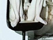 Barbie having a smoke naked in chair legs apart