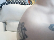 Slutty blonde with tats toying her pussy