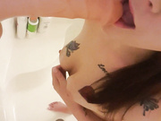 Sucking dildo in the shower