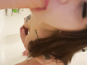 Sucking dildo in the shower